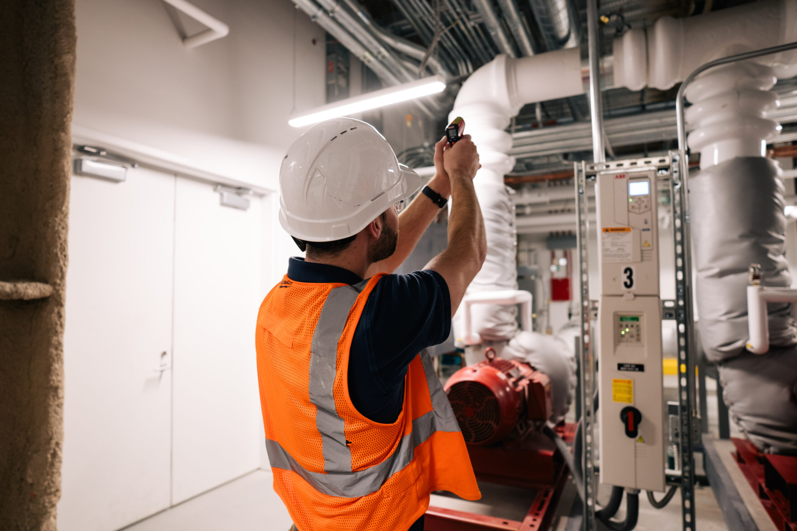engineers working on buildings taking temperature