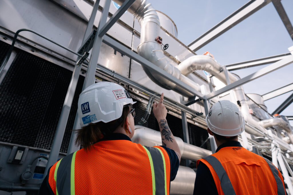 engineers working on buildings looking up