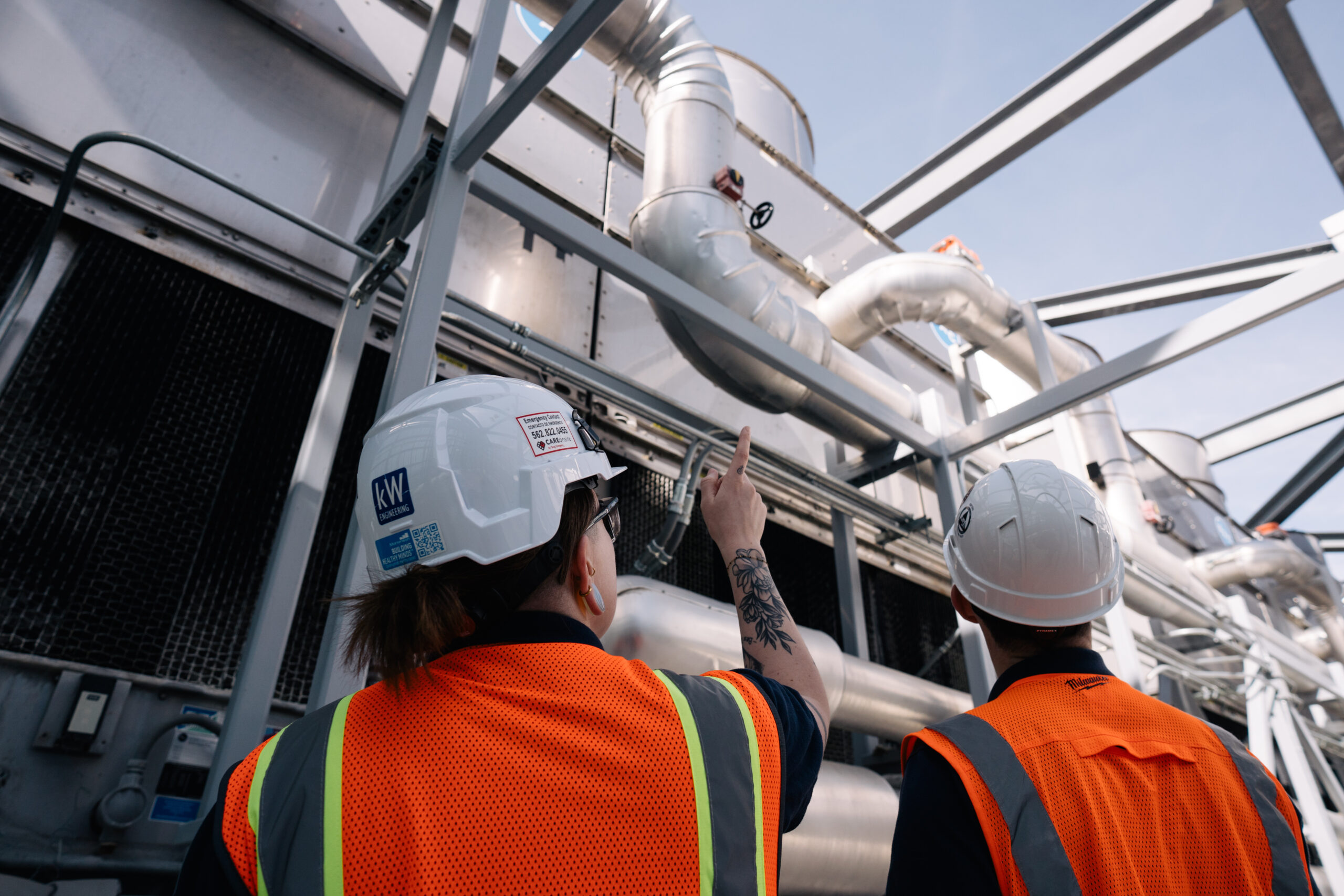 engineers working on buildings looking up
